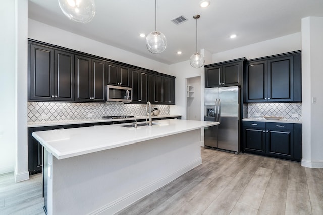 16958 Chapel Knox Dr, Humble, TX 77346 - kitchen featuring light countertops, appliances with stainless steel finishes, a sink, and visible vents