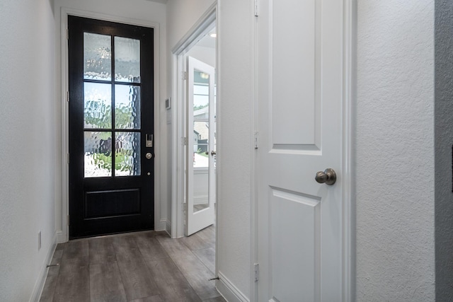 16958 Chapel Knox Dr, Humble, TX 77346 - entryway featuring dark wood-type flooring, baseboards, and a textured wall