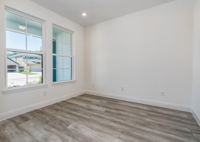 16958 Chapel Knox Dr, Humble, TX 77346 - empty room featuring wood finished floors, baseboards, and recessed lighting