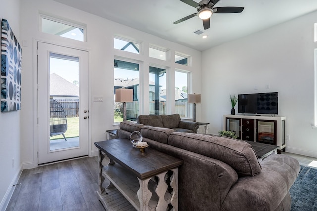 16958 Chapel Knox Dr, Humble, TX 77346 - living room featuring dark wood-style flooring, visible vents, baseboards, and a ceiling fan