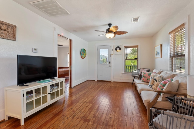 2216 Grover Ave, Galveston, TX 77551 - living area featuring wood-type flooring, a ceiling fan, and baseboards