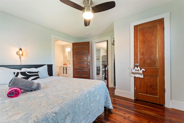 2216 Grover Ave, Galveston, TX 77551 - bedroom featuring dark wood-type flooring, baseboards, ensuite bathroom, and a ceiling fan