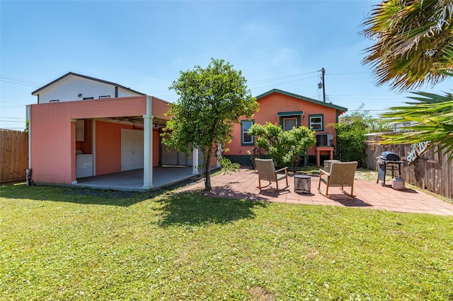 2216 Grover Ave, Galveston, TX 77551 - rear view of property featuring a patio area and an outdoor fire pit