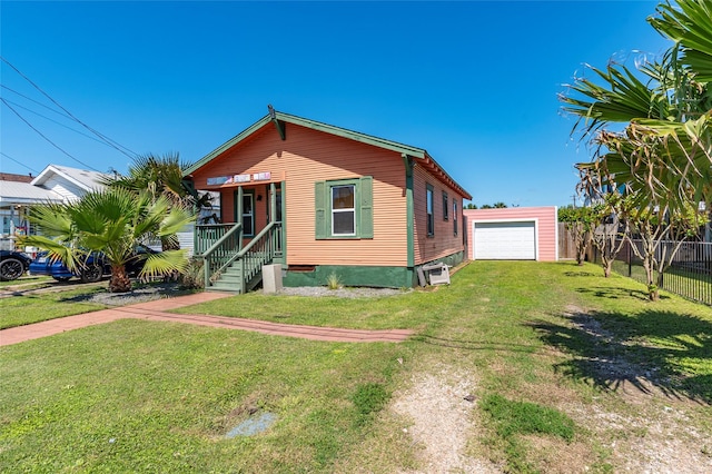 2216 Grover Ave, Galveston, TX 77551 - view of front of home featuring a detached garage and driveway