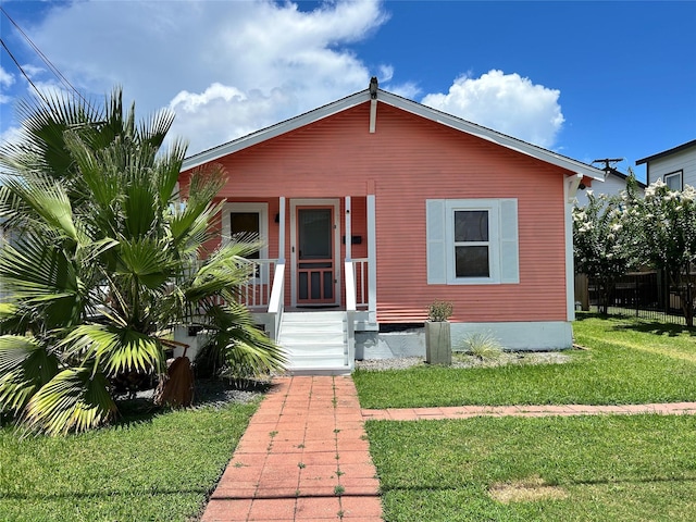 2216 Grover Ave, Galveston, TX 77551 - view of front of house with a front lawn