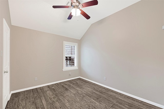 unfurnished room featuring vaulted ceiling, a ceiling fan, dark wood finished floors, baseboards, and visible vents