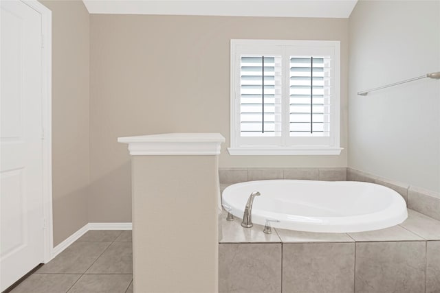 bathroom featuring a bath and tile patterned flooring