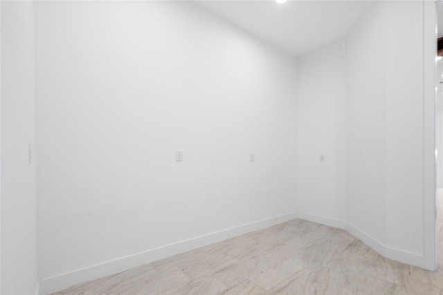 empty room featuring baseboards