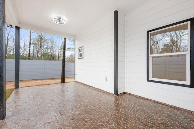 view of patio / terrace featuring fence