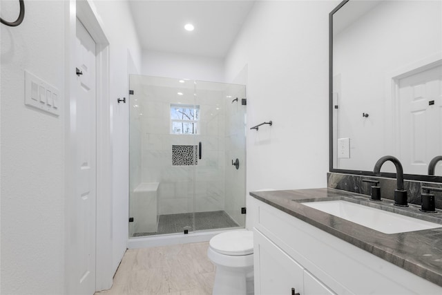 full bathroom with vanity, a stall shower, recessed lighting, toilet, and marble finish floor