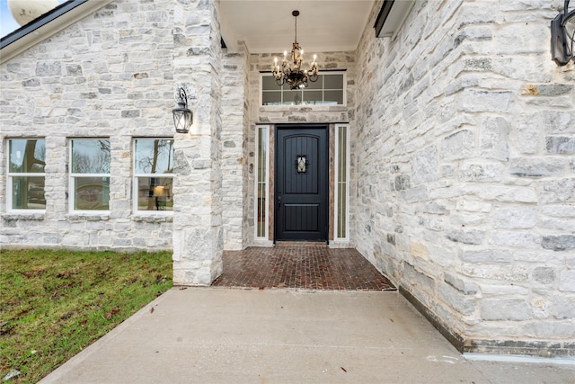 doorway to property with stone siding