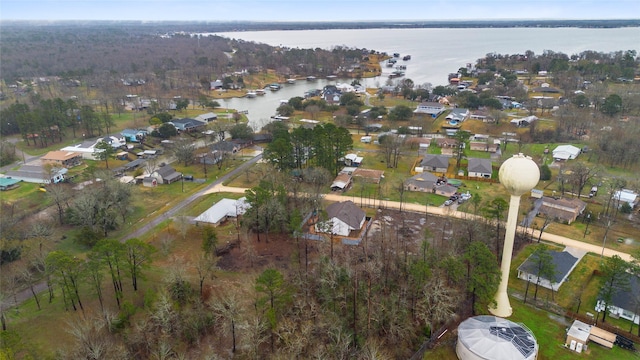 drone / aerial view featuring a residential view and a water view