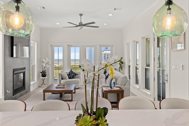11370 Beachside, Galveston, TX 77554 - living room featuring visible vents, ceiling fan, recessed lighting, and a glass covered fireplace