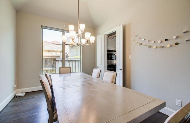 dining space featuring a chandelier, dark wood-style flooring, baseboards, and vaulted ceiling