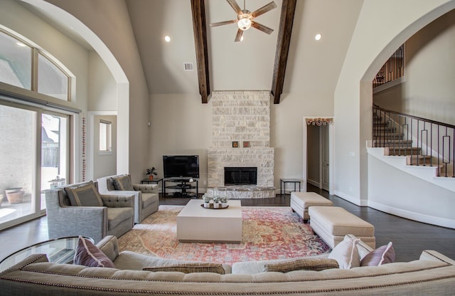 living room featuring wood finished floors, high vaulted ceiling, ceiling fan, and visible vents