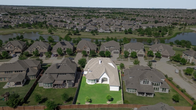 bird's eye view with a residential view and a water view
