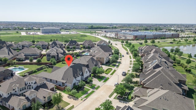 drone / aerial view with a residential view and a water view