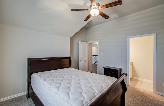 carpeted bedroom with visible vents, baseboards, vaulted ceiling, and a ceiling fan