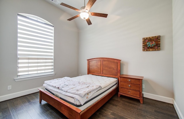 bedroom with dark wood-style flooring, baseboards, and visible vents
