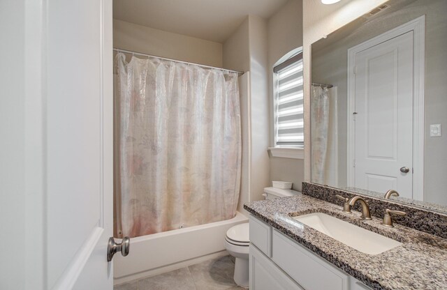 bathroom with toilet, vanity, shower / bath combination with curtain, and tile patterned flooring