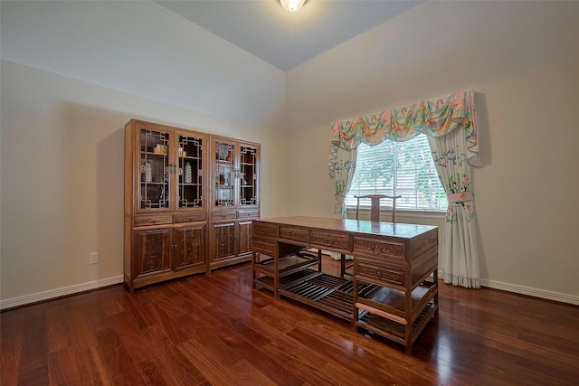 home office with dark wood-type flooring, baseboards, and vaulted ceiling