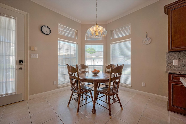 dining area with baseboards, light tile patterned flooring, a notable chandelier, and plenty of natural light