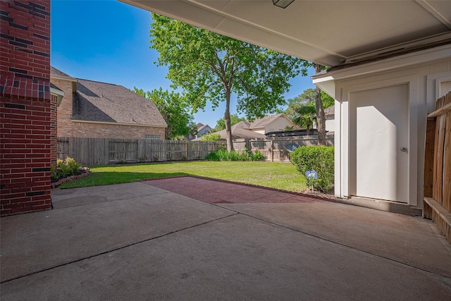view of patio with a residential view and a fenced backyard