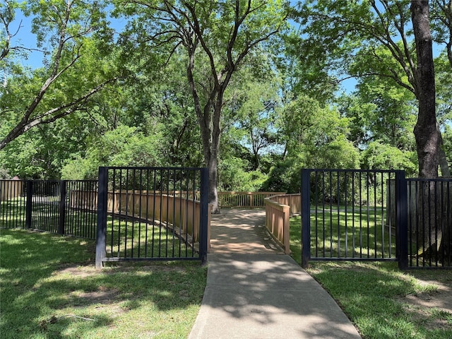 view of gate with fence