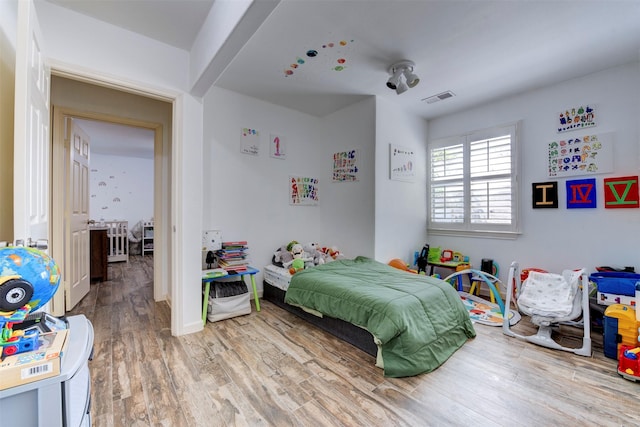 4103 Donna Lynn Dr, Houston, TX 77092 - bedroom with wood finished floors and visible vents