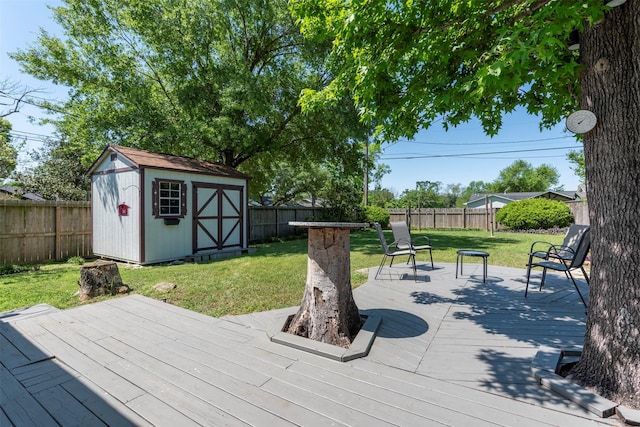 4103 Donna Lynn Dr, Houston, TX 77092 - wooden terrace featuring a storage shed, a yard, a fenced backyard, and an outbuilding