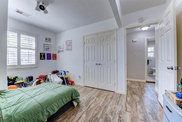 4103 Donna Lynn Dr, Houston, TX 77092 - bedroom with visible vents, baseboards, a closet, and wood finished floors