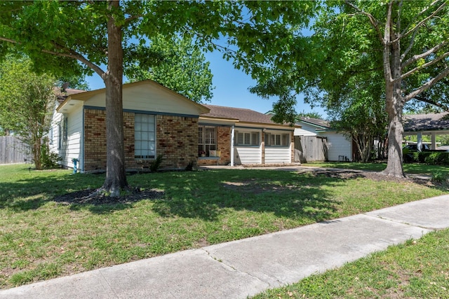 4103 Donna Lynn Dr, Houston, TX 77092 - ranch-style home featuring brick siding, a front yard, and fence