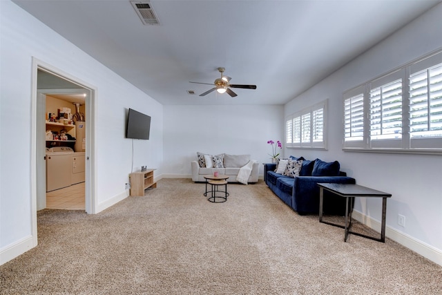 4103 Donna Lynn Dr, Houston, TX 77092 - carpeted living room with separate washer and dryer, baseboards, visible vents, and ceiling fan