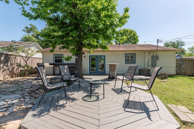 4103 Donna Lynn Dr, Houston, TX 77092 - wooden deck featuring central AC, french doors, fence, and a lawn