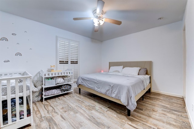 4103 Donna Lynn Dr, Houston, TX 77092 - bedroom with baseboards, a ceiling fan, and wood finished floors