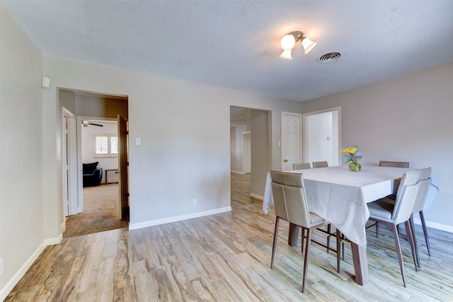 4103 Donna Lynn Dr, Houston, TX 77092 - dining room featuring visible vents, baseboards, light wood finished floors, and a textured ceiling