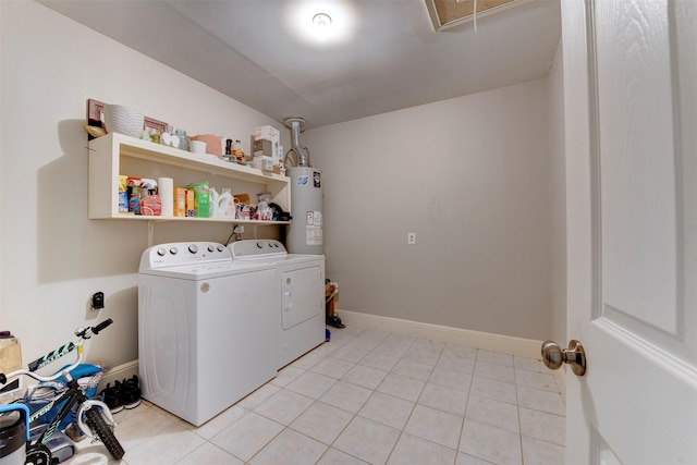 4103 Donna Lynn Dr, Houston, TX 77092 - clothes washing area with laundry area, light tile patterned floors, independent washer and dryer, water heater, and baseboards