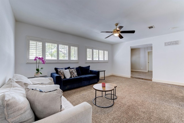 4103 Donna Lynn Dr, Houston, TX 77092 - living area featuring light carpet, visible vents, baseboards, and ceiling fan