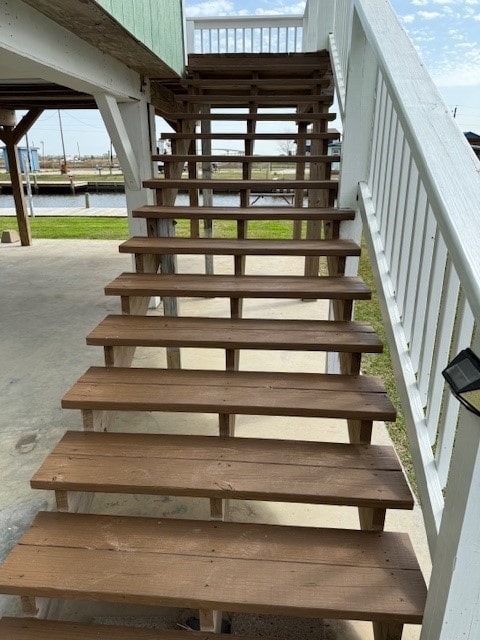 stairway featuring a water view