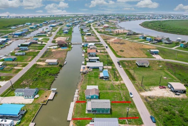 bird's eye view featuring a residential view and a water view