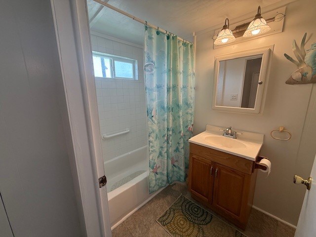bathroom with shower / bath combination with curtain and vanity