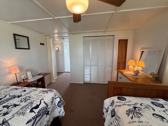 carpeted bedroom with baseboards, a ceiling fan, and a closet