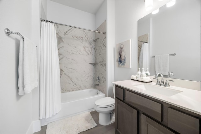 bathroom with vanity, shower / bath combination with curtain, and toilet