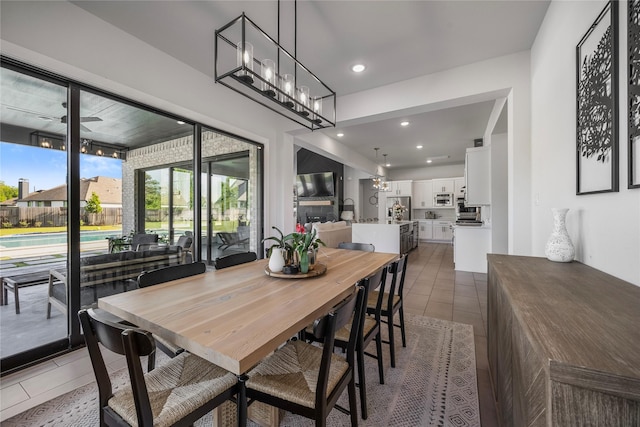 dining room with light tile patterned floors and recessed lighting