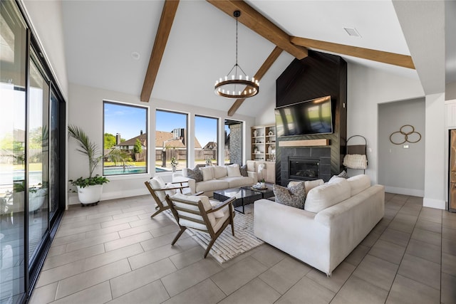 living room featuring high vaulted ceiling, an inviting chandelier, beamed ceiling, a large fireplace, and baseboards