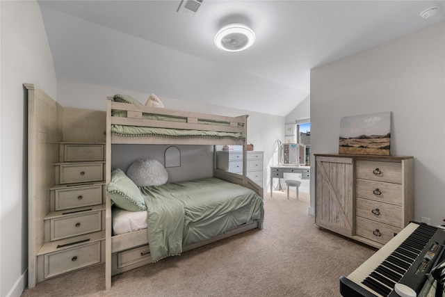 bedroom featuring visible vents, light colored carpet, and lofted ceiling