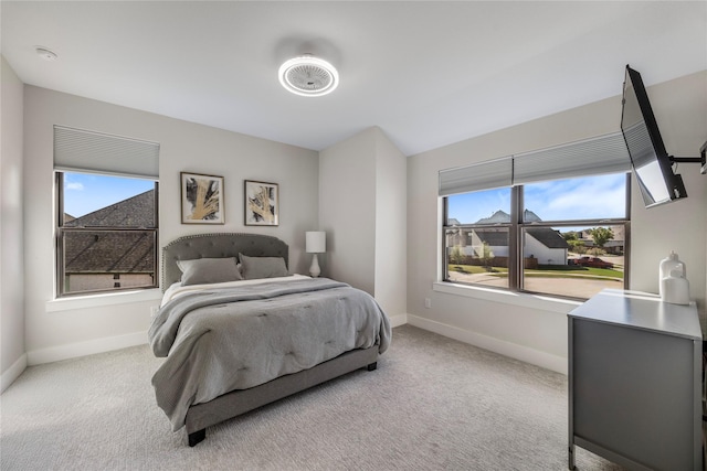 bedroom with carpet floors and baseboards