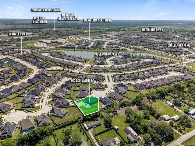 birds eye view of property featuring a water view and a residential view