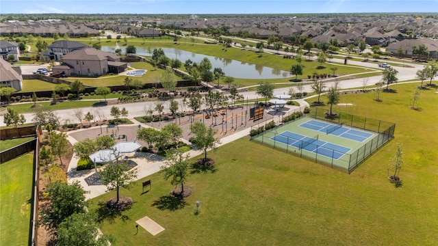 birds eye view of property featuring a residential view and a water view