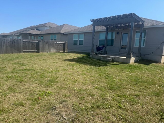 14020 Heartland Dr, Manor, TX 78653 - view of yard with a pergola, fence, and a patio area